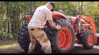 Installing Trygg Ice and Forestry Chains on the Tractor [upl. by Ttergram916]