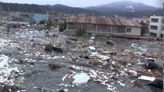 Tsunami in Kesennuma city ascending the Okawa river [upl. by Earehs]