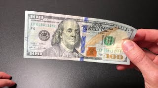 How to spot a fake 100 dollar bill [upl. by Tips]