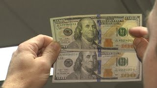 WEB EXTRA Comparing a fake and real 100 bill [upl. by Freddi]